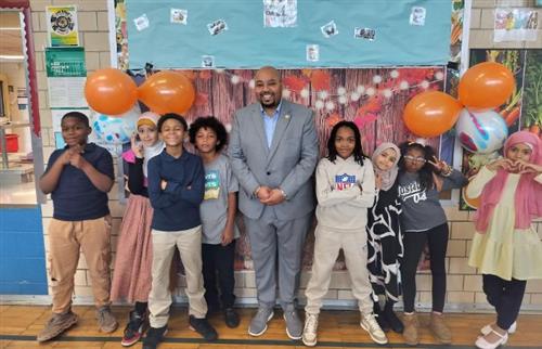  student council members posing with councilman of Detroit